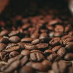 local coffee roasters in St. Pete fresh roasted beans spilling from a burlap bag on a wooden surface