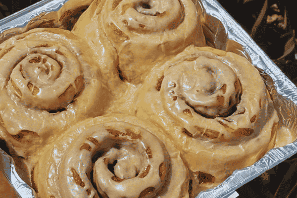 Freshly iced cinnamon rolls in a foil pan from The Golden Grain in St. Pete